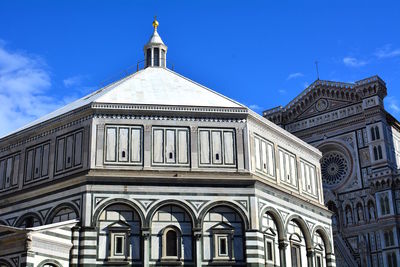 Low angle view of building against blue sky