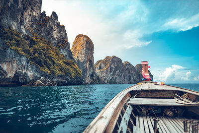 Scenic view of sea seen through boat against sky