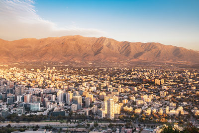 Aerial view of townscape against sky during sunset