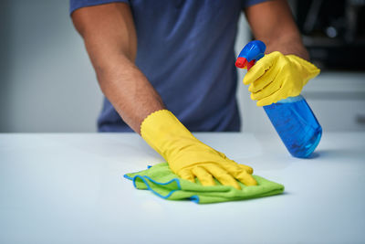 High angle view of man playing with toy on table