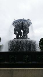 Low angle view of fountain against sky