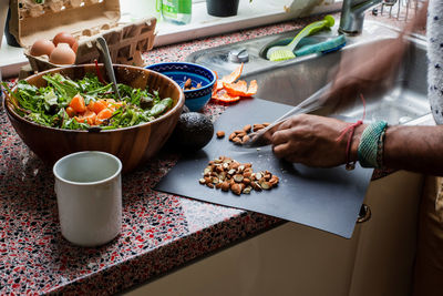 Midsection of man preparing food on table