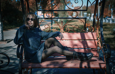 Portrait of woman sitting on chair