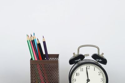 Close-up of multi colored pencils against white background