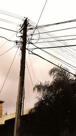 Low angle view of electricity pylon