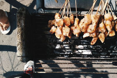 High angle view of meat on barbecue grill