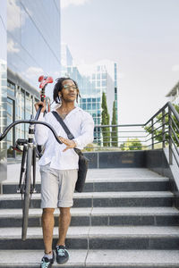 Full length of man standing on staircase