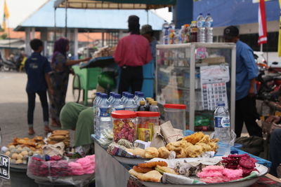 People at market stall