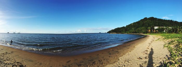 Scenic view of sea against blue sky