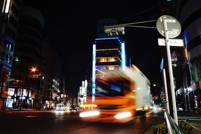 Illuminated city street at night