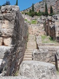 View of old ruins on mountain against sky