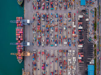 High angle view of commercial dock by buildings in city