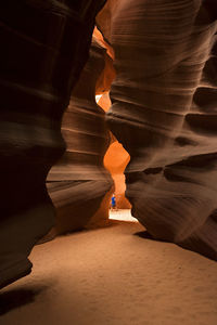 Boy standing in antelope canyon