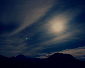 Scenic view of silhouette mountains against sky at sunset