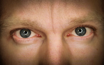 Midsection of man with gray eyes