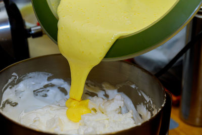 Close-up of yellow pouring in bowl