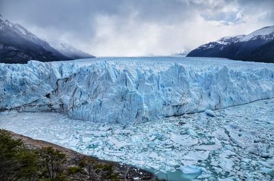 Scenic view of glacier against sky