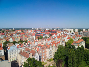 High angle shot of townscape against clear blue sky