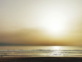 Scenic view of sea against clear sky during sunset