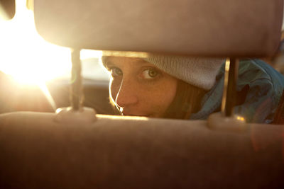 Close-up portrait of young woman looking away