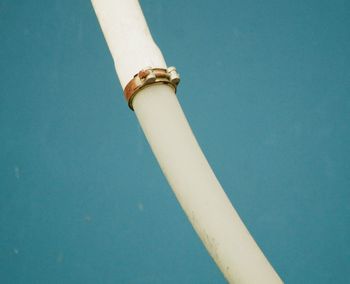 Pipe hanging on blue background