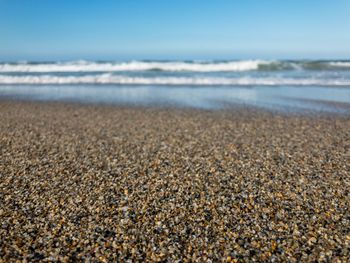 Surface level of beach against sky