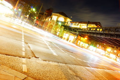 Light trails on road in city at night