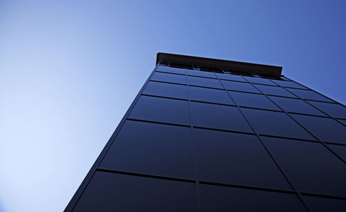 Low angle view of modern building against clear sky