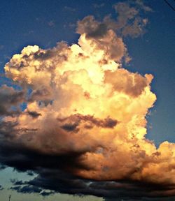 Low angle view of cloudy sky at sunset
