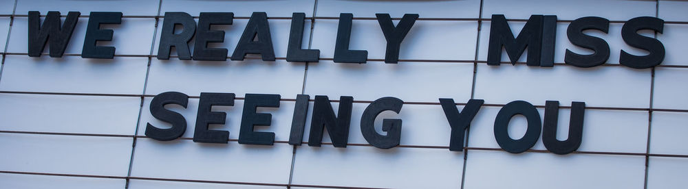 Close-up of text on glass floor