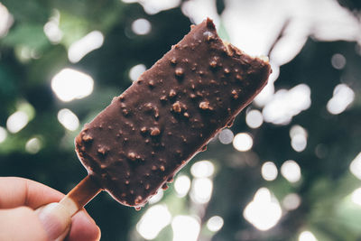 Close-up of cropped hand holding ice cream