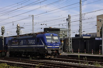 Train on railroad tracks against sky