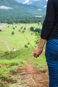 Woman standing on field