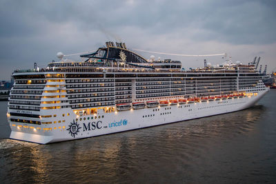 Ship moored on sea against sky