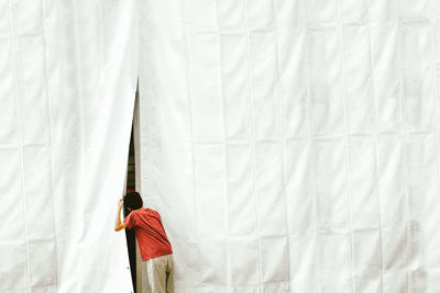 High angle view of clothes hanging on bed