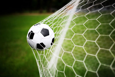 Close-up of ball on soccer field