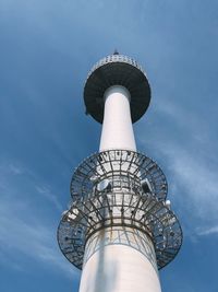 Low angle view of communications tower against sky