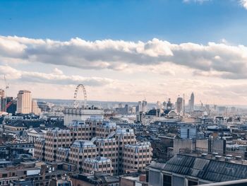 High angle view of buildings in city against sky