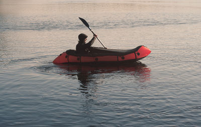 Travel on the water on a packraft inflatable rowboat. active lifestyle theme