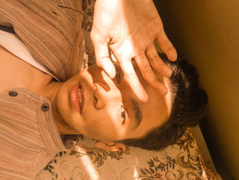 High angle view of woman sleeping on bed