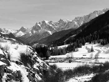 Scenic view of snow covered mountains against sky