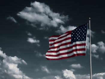 Low angle view of flag against sky