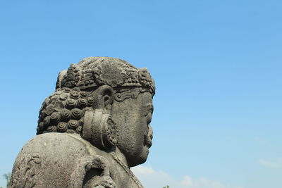 Low angle view of statue against clear blue sky