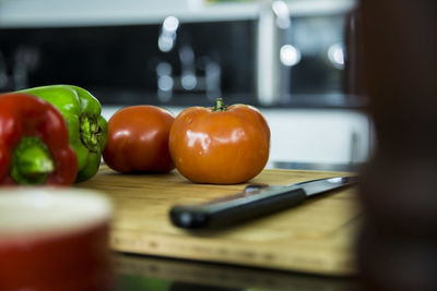 Vegetables and knife on cutting board