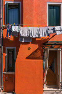 Clothes drying on balcony of building