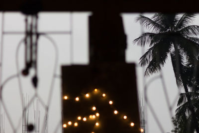 Low angle view of illuminated lights at night