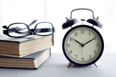 Close-up of clock on table