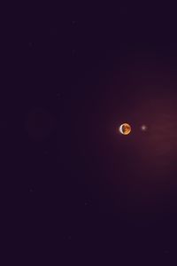 Low angle view of moon against sky at night