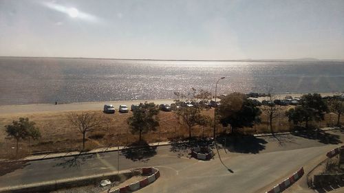 High angle view of road by sea against sky