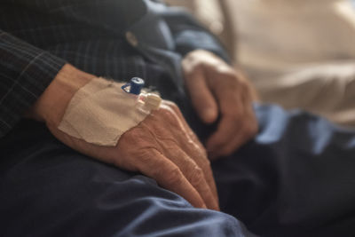 Close-up of man holding mobile phone